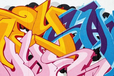 High angle view of multi colored graffiti on wall