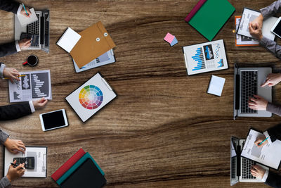 High angle view of business colleagues working on table