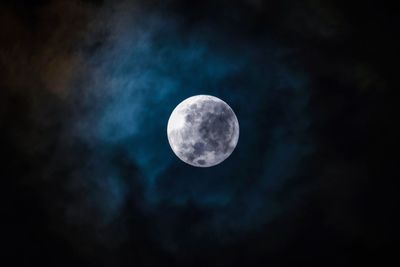 Low angle view of moon against sky at night