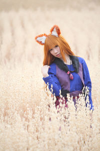 Woman wearing mask on field