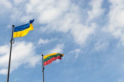 Low angle view of flag against sky