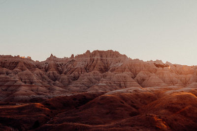 Rock formations in desert against clear sky