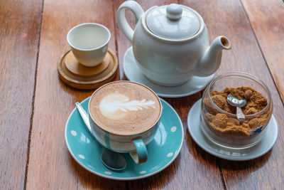 High angle view of coffee cups on table