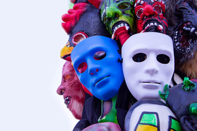 Close-up of masks for sale against white background