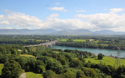 Scenic view of mountains against cloudy sky