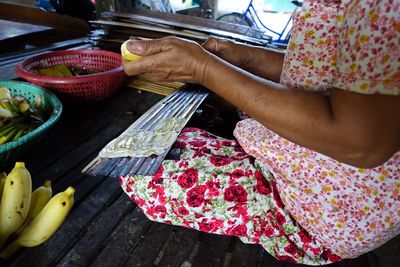 Midsection of woman preparing food