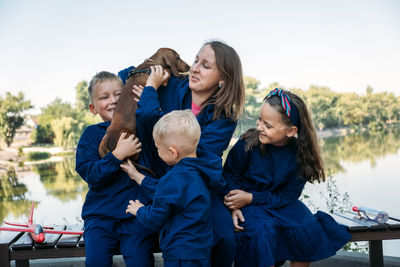 Large family parenting, single mom with large family. single mum and three kids playing together