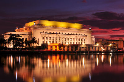 Reflection of building in water at night