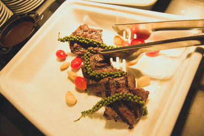 High angle view of fish in plate on table