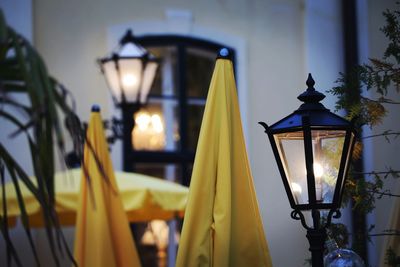 Close-up of illuminated lamp at night