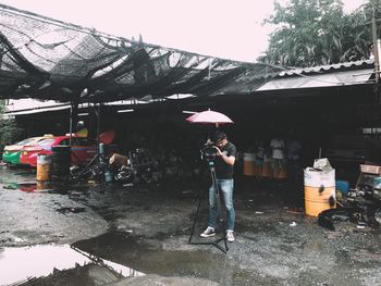 Man working with umbrella