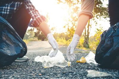 Low section of people walking on road