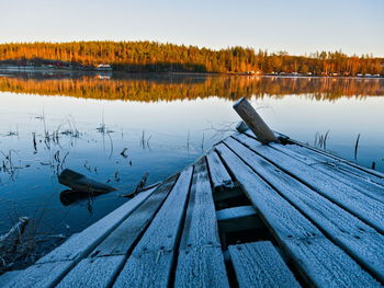 Pier over lake against sky