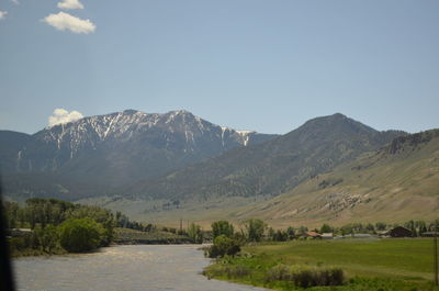 Scenic view of landscape and mountains against sky