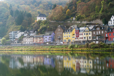 Buildings by lake in town