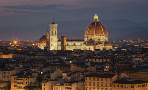 High angle view of illuminated buildings in city against sky florence 