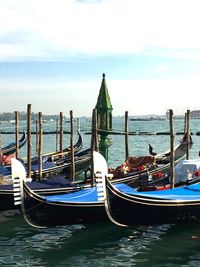 Boats moored in sea