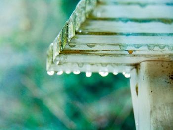 Water drops on bench during rainy season