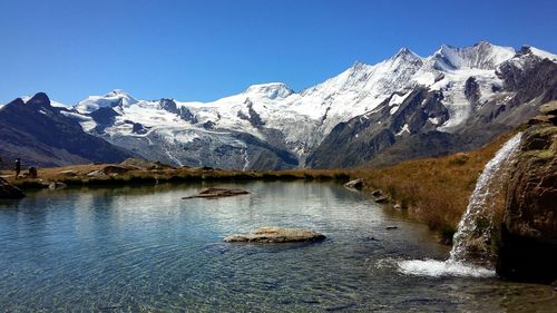 Scenic view of mountain range against clear sky