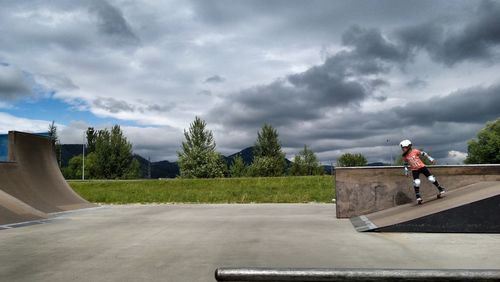 Boy skateboarding at skateboard park