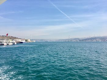 Scenic view of sea against blue sky