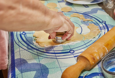 Cropped hand of person holding jigsaw piece