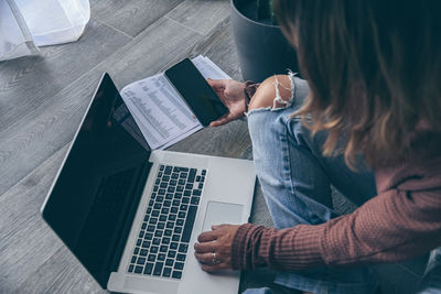 Young woman working on laptop at home. teenager making an internet video call. girl studying online.