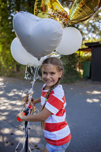 Portrait of boy with balloons