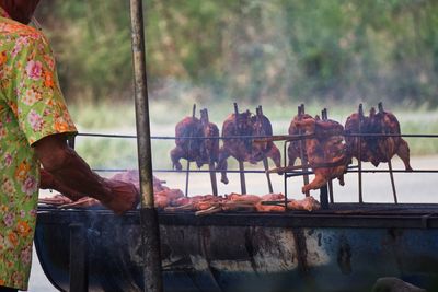 Panoramic shot of meat on barbecue grill