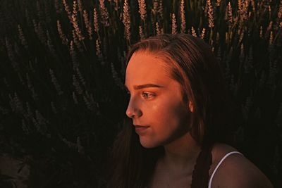 Close-up of thoughtful young woman looking away