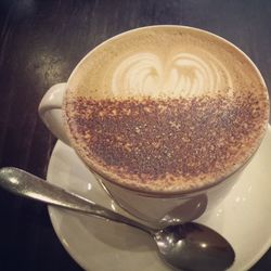 Close-up of served coffee cup on table