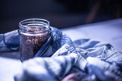 Close-up of glass jar on table