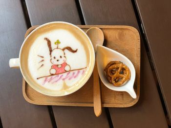 Close-up of cappuccino served on table