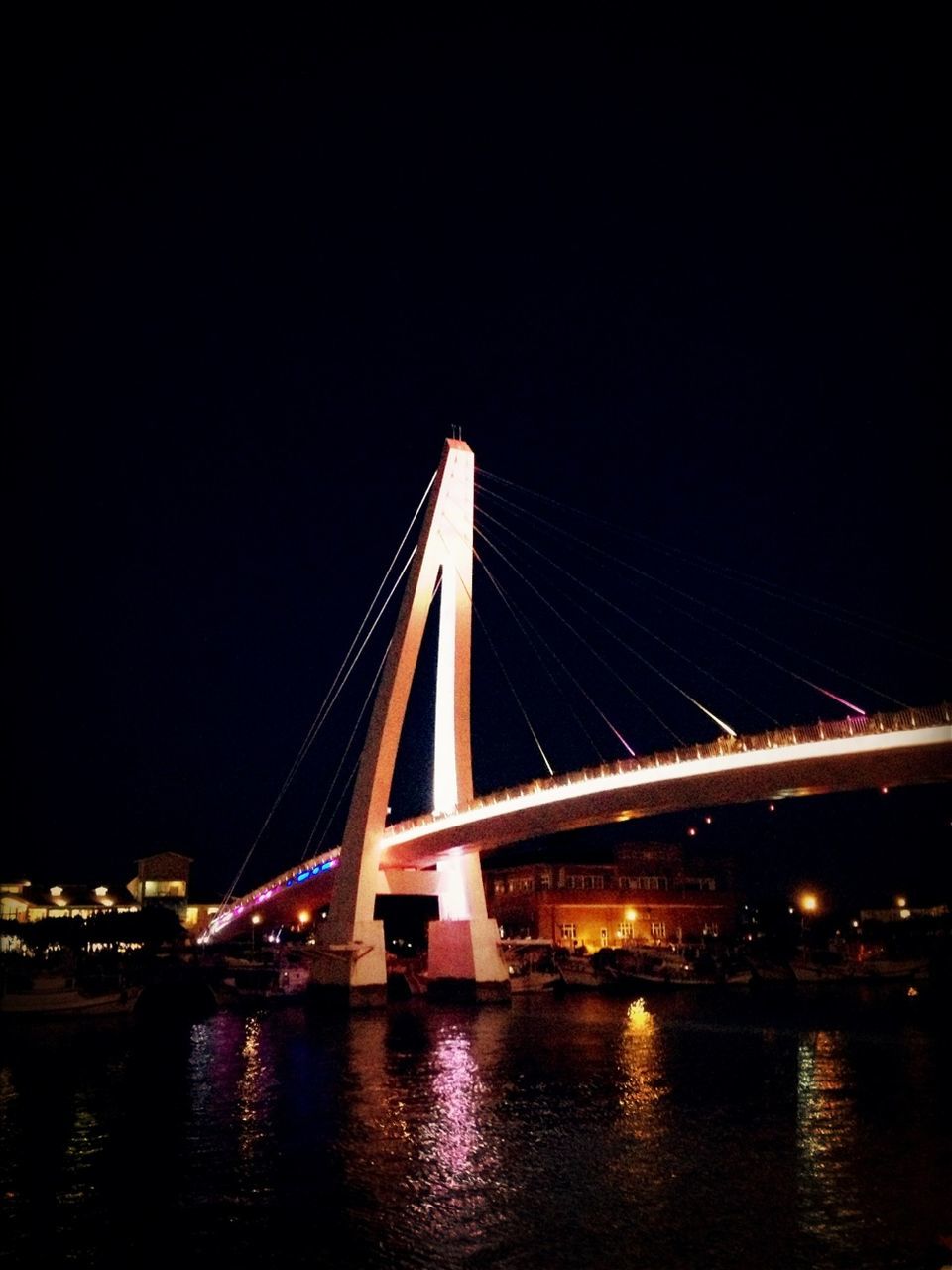 connection, bridge - man made structure, architecture, built structure, illuminated, night, transportation, engineering, water, bridge, river, suspension bridge, waterfront, clear sky, copy space, travel destinations, city, travel, famous place, sky