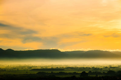 Scenic view of silhouette landscape against sky during sunset