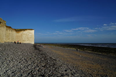 Scenic view of sea against blue sky