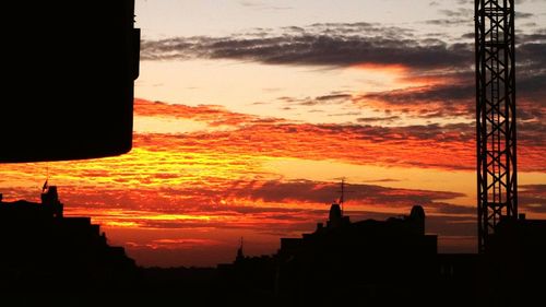 Silhouette of building at sunset