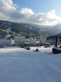 High angle view of houses and mountains against sky