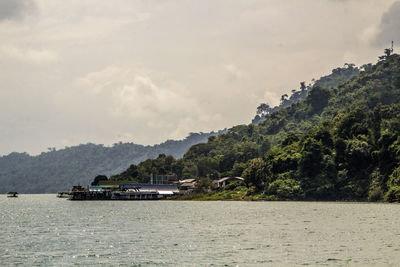 Boat sailing on sea against sky
