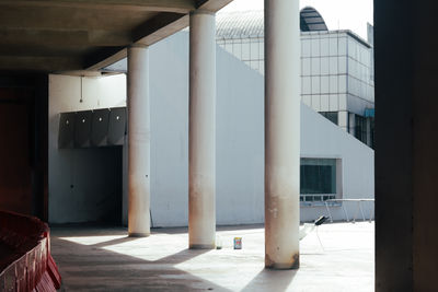 Footpath amidst buildings in city