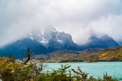 Scenic view of lake and mountains against sky