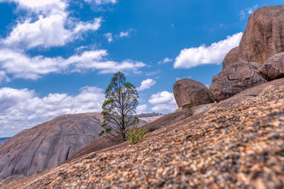 Rock formations on mountain against sky