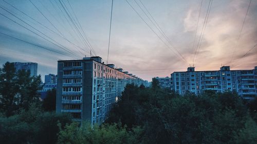 Buildings against sky during sunset