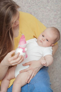 Cute baby girl holding hands