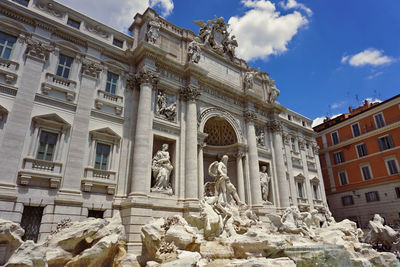 Low angle view of historical building against cloudy sky