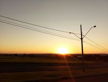 Scenic view of field against sky during sunset