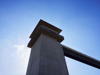 Low angle view of built structure against clear blue sky