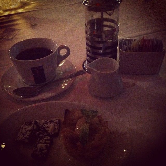 indoors, drink, food and drink, table, refreshment, still life, drinking glass, coffee cup, freshness, close-up, cup, glass - material, coffee - drink, high angle view, plate, no people, saucer, glass, tea - hot drink, tea cup