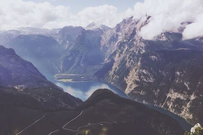 Scenic view of mountains against cloudy sky