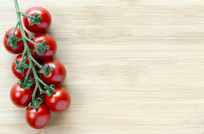 Close-up of cherry tomatoes on wooden table